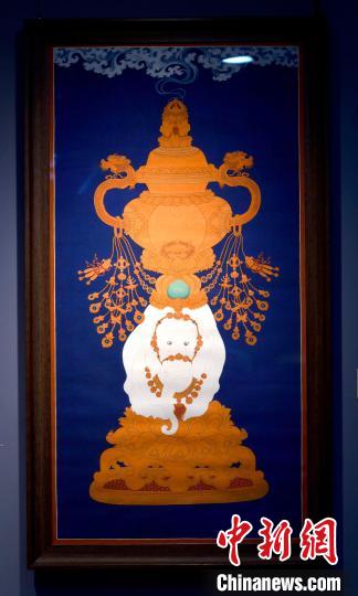 圖為5月16日，展覽中的新創(chuàng)唐卡作品《瑞象承香》?！±盍?攝